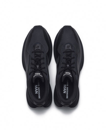 Black New Balance TF100